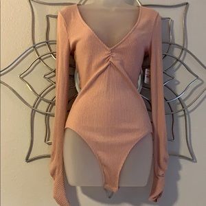 Pink body suit